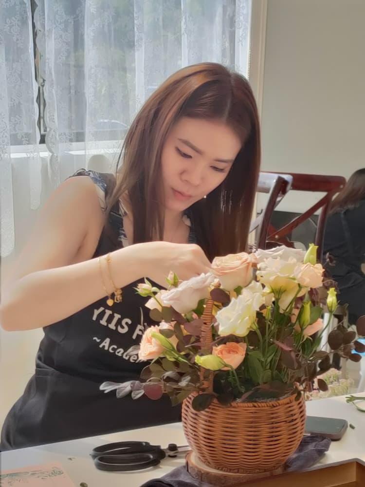 an apprentice working on her flower design