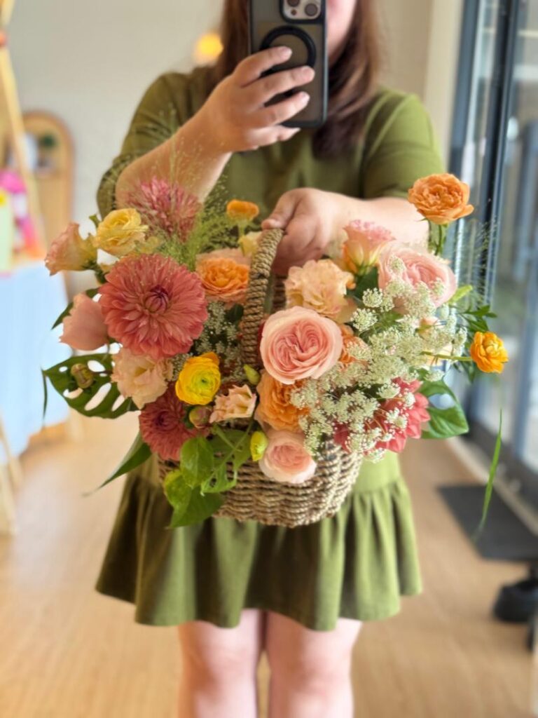 a florist holding a beautiful bouquet