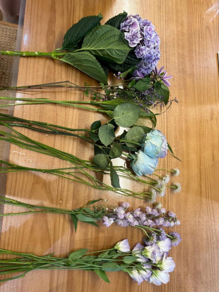 flowers on workbench being prepped for arrangement